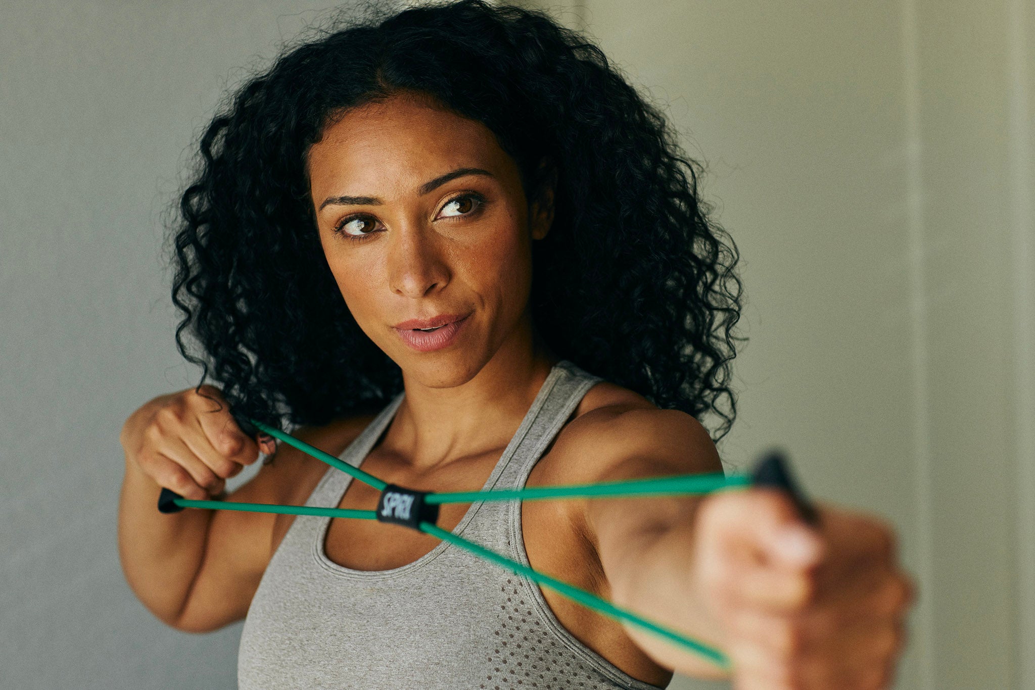 Woman pulling on green Ultra Toner